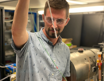Dr Danila Barskiy. © Danila Barskiy Photo of Danila Barskiy holding an NMR tube